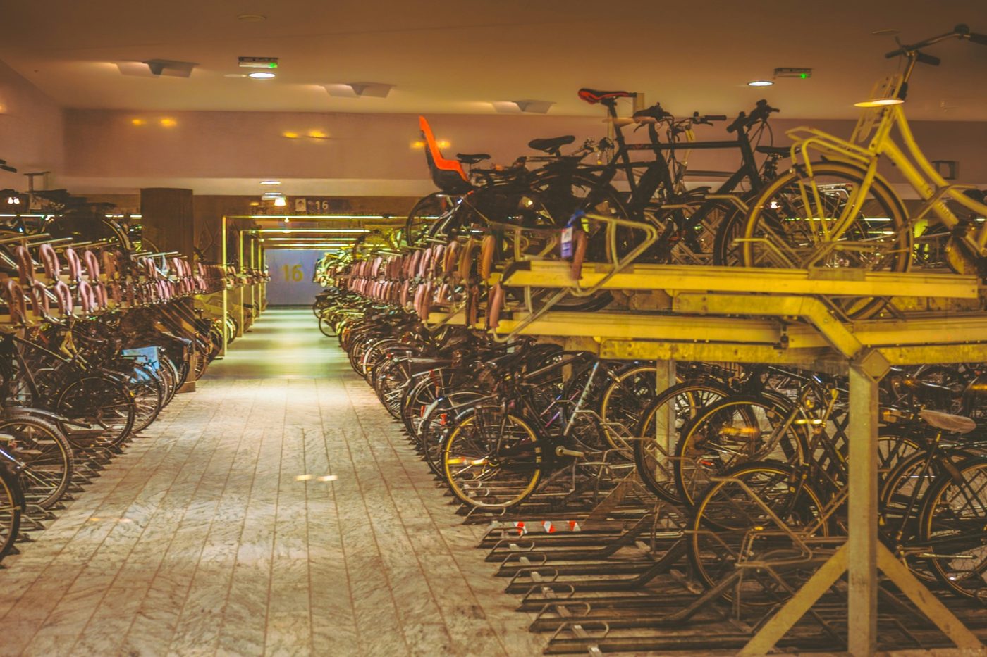 Large indoor shared bike-parking facility with multiple racks